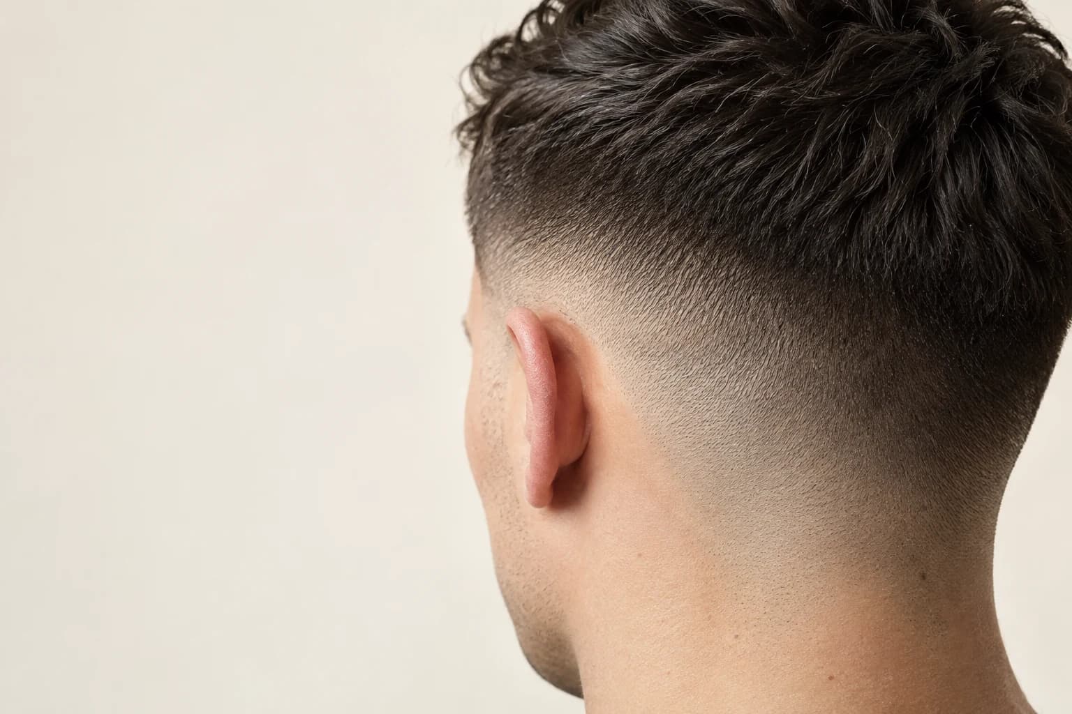 Clean fade against a studio background